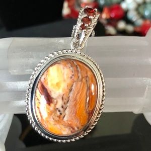 Gem insider Lion’s Paw & Garnet pendant